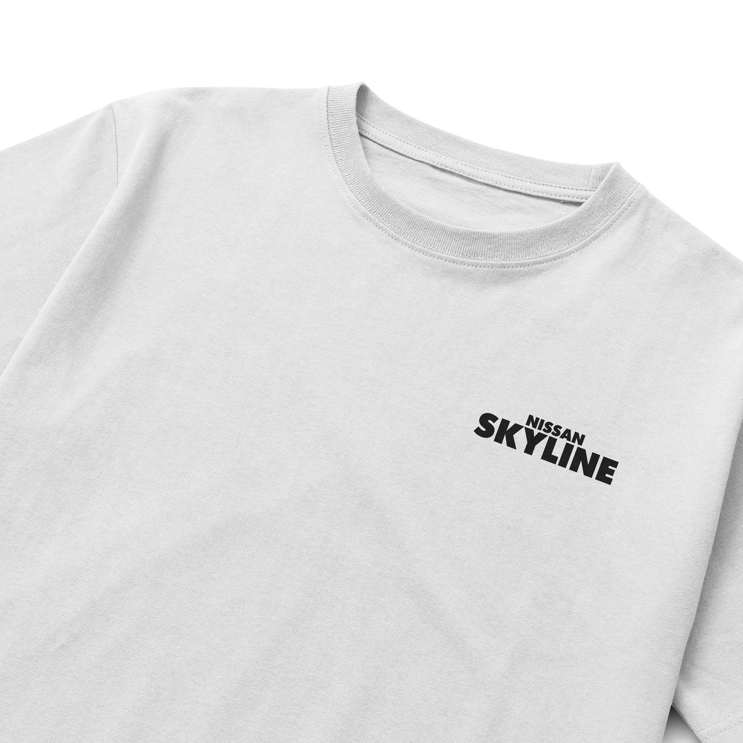 Black and white T-shirts featuring detailed blueprints and an illustration of the Nissan Skyline GT-R R34 with bold “NISSAN SKYLINE” lettering in blue.