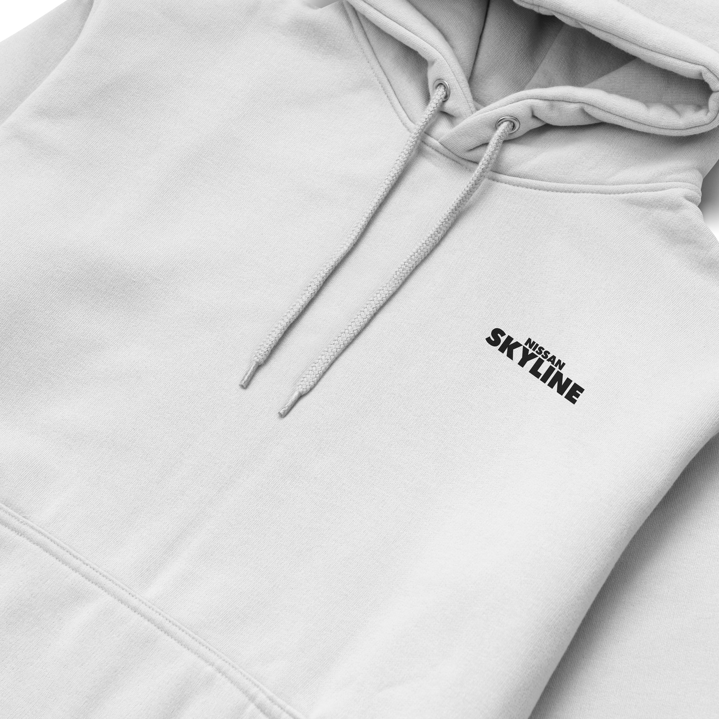 Black and white hoodies featuring the Nissan Skyline GT-R R34 blueprint design with technical views of the car and bold blue “SKYLINE” typography.