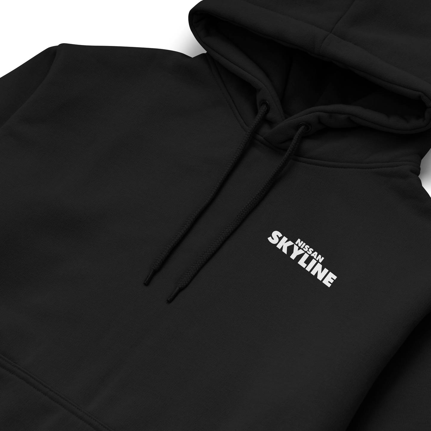 Black and white hoodies featuring the Nissan Skyline GT-R R34 blueprint design with technical views of the car and bold blue “SKYLINE” typography.