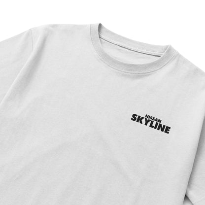 Black and white T-shirts featuring detailed blueprints and an illustration of the Nissan Skyline GT-R R34 with bold “NISSAN SKYLINE” lettering in blue.